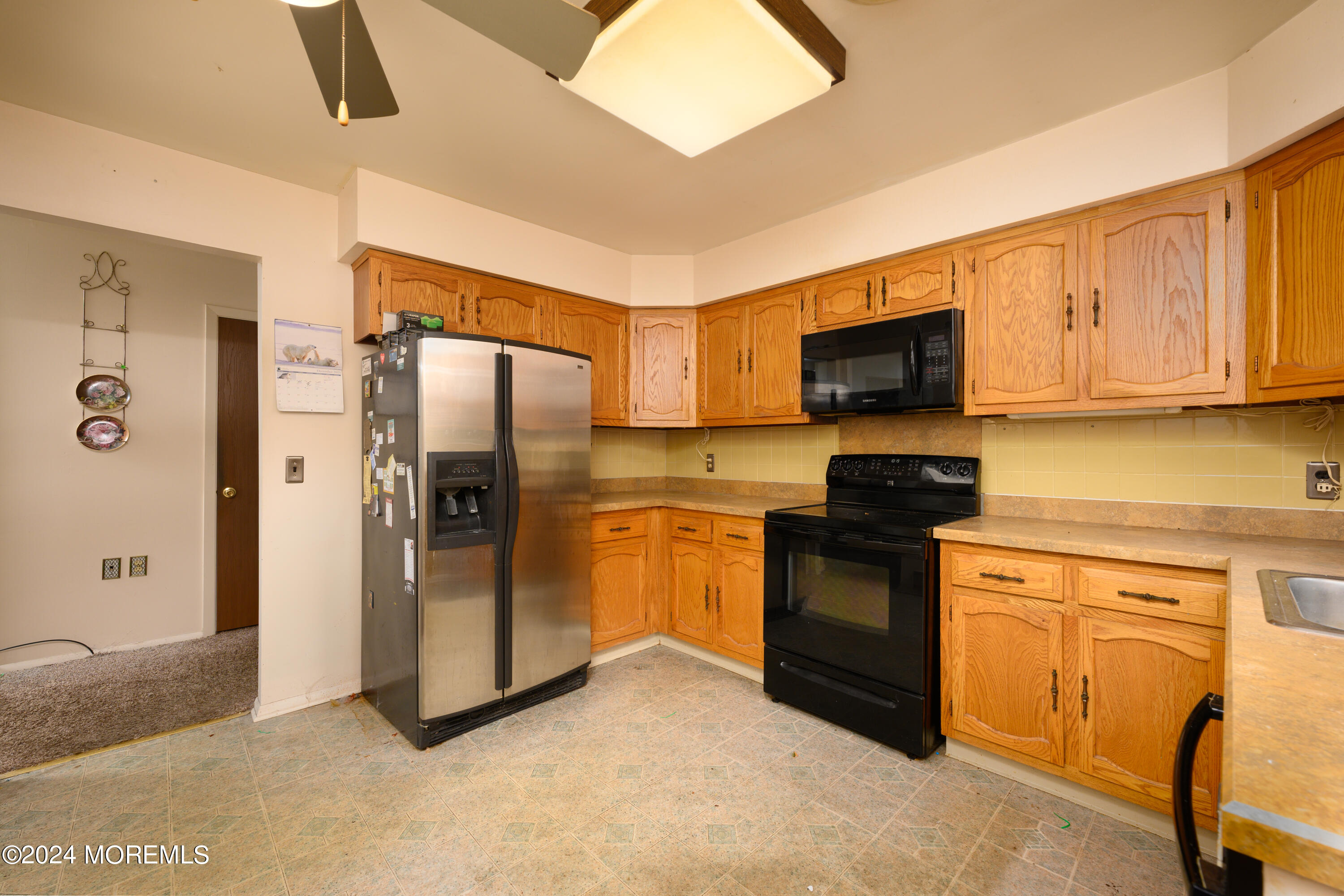 150 B Sunset Road Whiting, NJ 08759 - Photo 8 of 16 a kitchen with stainless steel appliances granite countertop a refrigerator stove and microwave