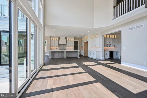 a view of an entryway with wooden floor and door