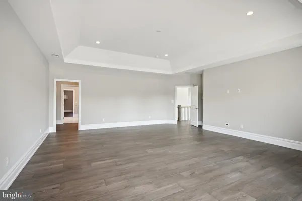 an empty room with windows and outside view