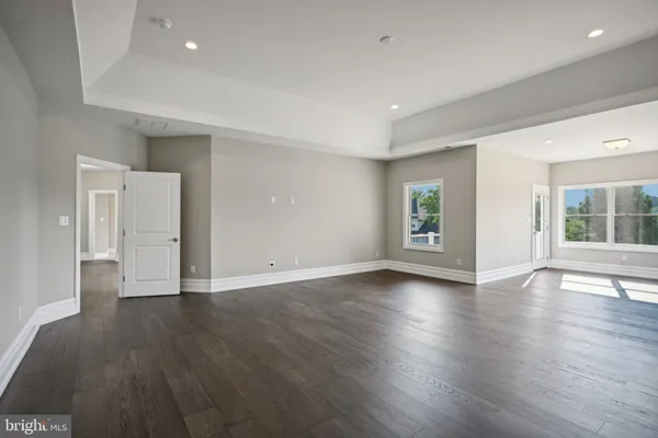 an empty room with windows and yard
