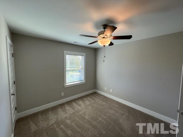 355 South Church Street Coats, NC 27521 - Photo 12 of 17 a view of an empty room with a window
