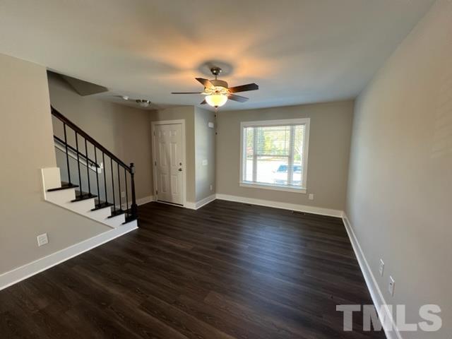 355 South Church Street Coats, NC 27521 - Photo 2 of 17 a view of an empty room with wooden floor and a window