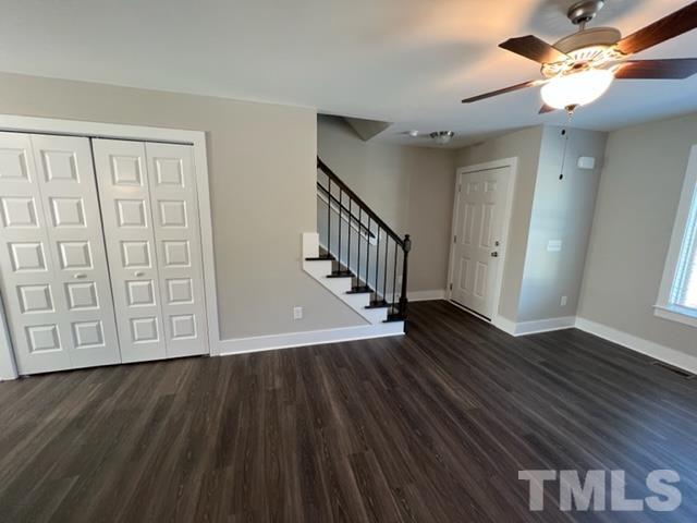 355 South Church Street Coats, NC 27521 - Photo 4 of 17 a view of an empty room with wooden floor and a ceiling fan