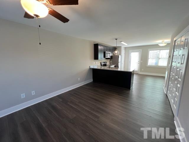 355 South Church Street Coats, NC 27521 - Photo 7 of 17 a view of kitchen and hall with wooden floor