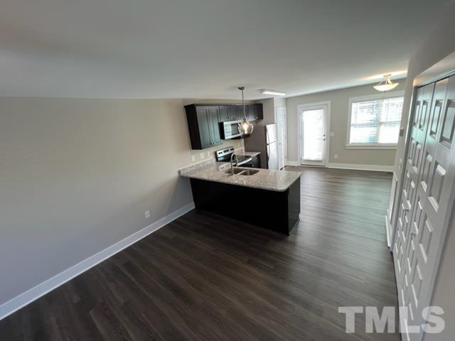 355 South Church Street Coats, NC 27521 - Photo 9 of 17 a room with wooden floor table and chairs
