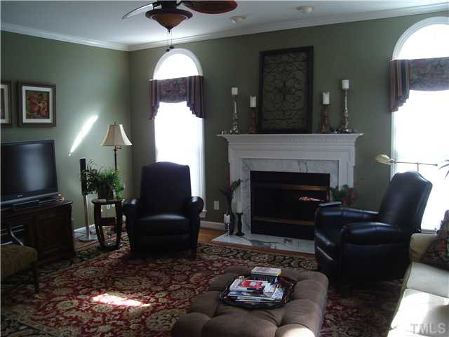2716 Dray Court Raleigh, NC 27613 - Photo 12 of 25 open fireplaced, wtih beautiful hardwoods. elegant Den/Family/Great Room