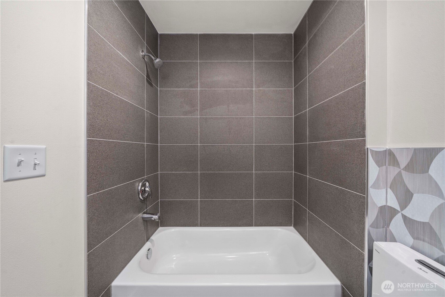 11535 17th Place Southwest Burien, WA 98146 - Photo 29 of 40 a bath tub sitting next to a white sink