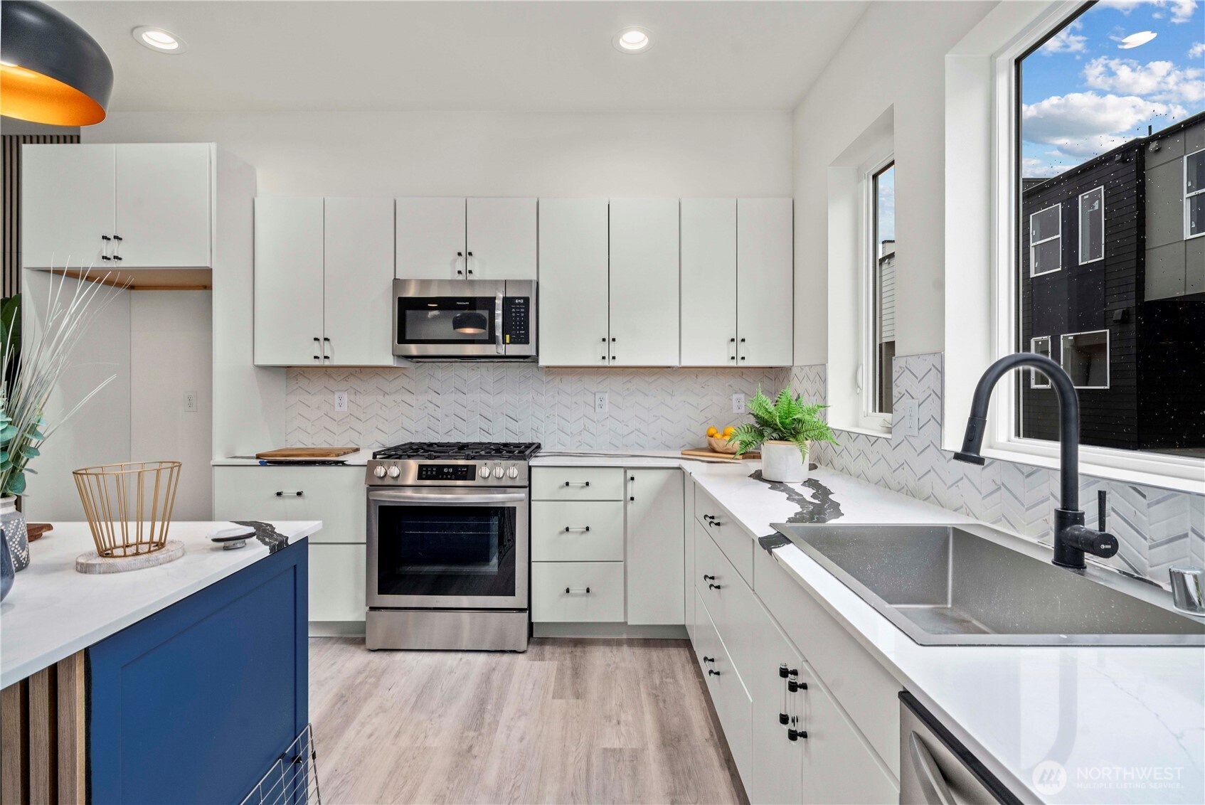 11535 17th Place Southwest Burien, WA 98146 - Photo 8 of 40 a kitchen with stainless steel appliances granite countertop a sink stove and cabinets