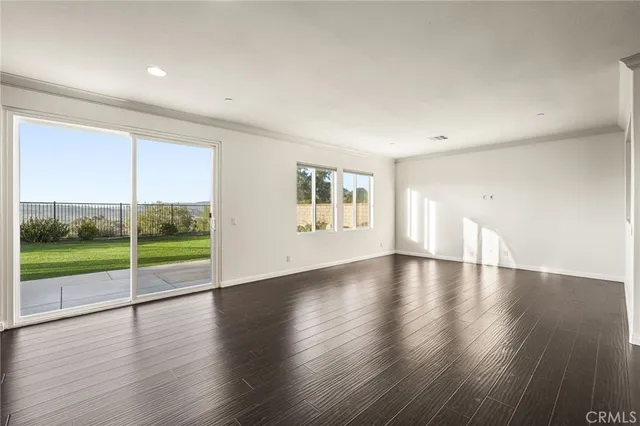 a view of kitchen with wooden floor and windows