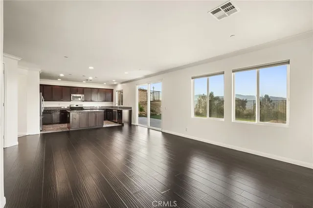 a view of kitchen with cabinets and wooden floor