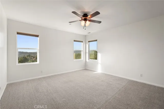 a view of a livingroom with a ceiling fan