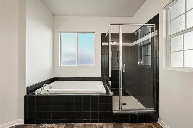a bathroom with a granite countertop sink a large mirror and vanity