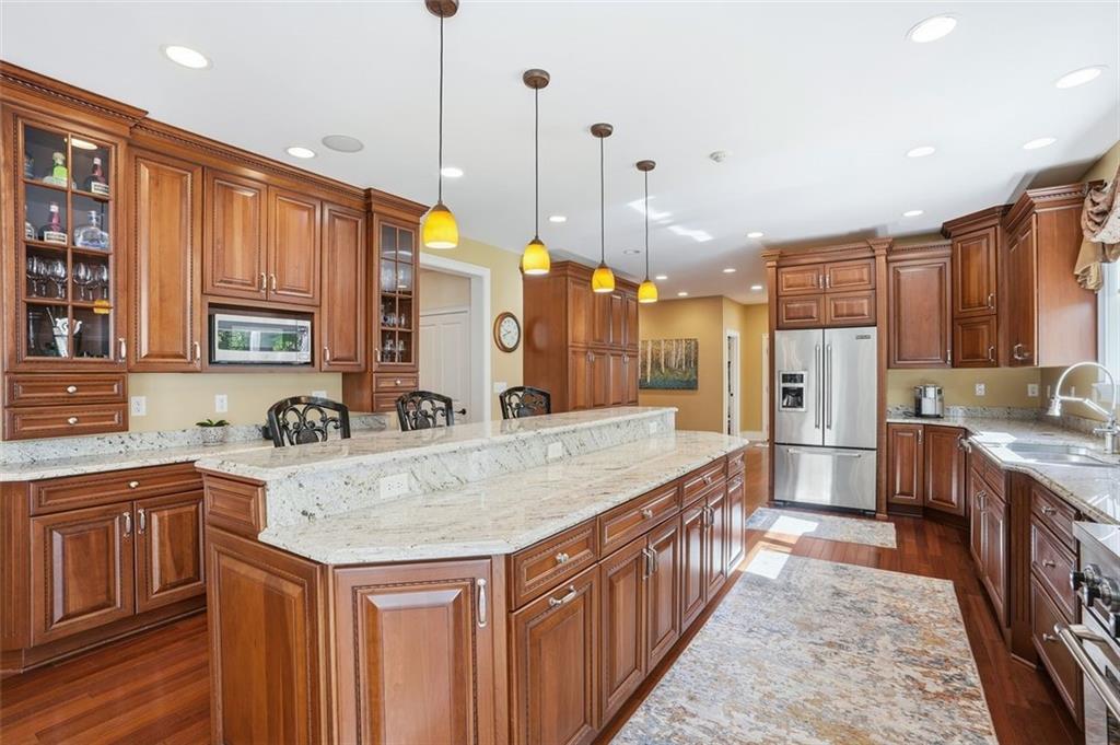1040 Chanticleer Drive Crescent, PA 15046 - Photo 12 of 50 a kitchen with stainless steel appliances granite countertop a sink a stove and a refrigerator