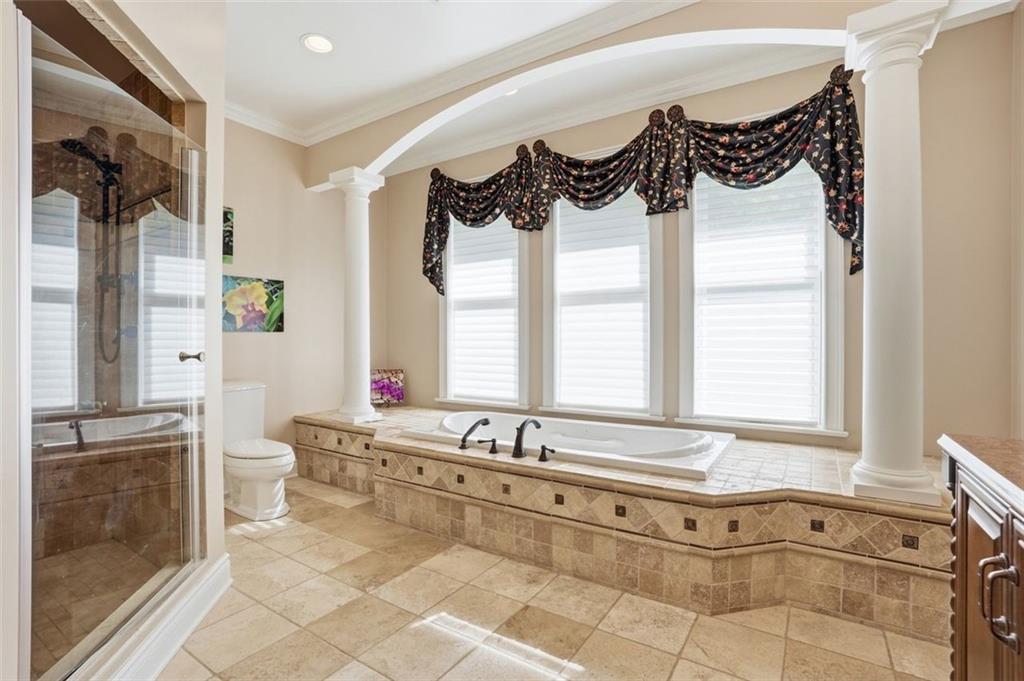 1040 Chanticleer Drive Crescent, PA 15046 - Photo 25 of 50 a spacious bathroom with a bathtub a sink and a window