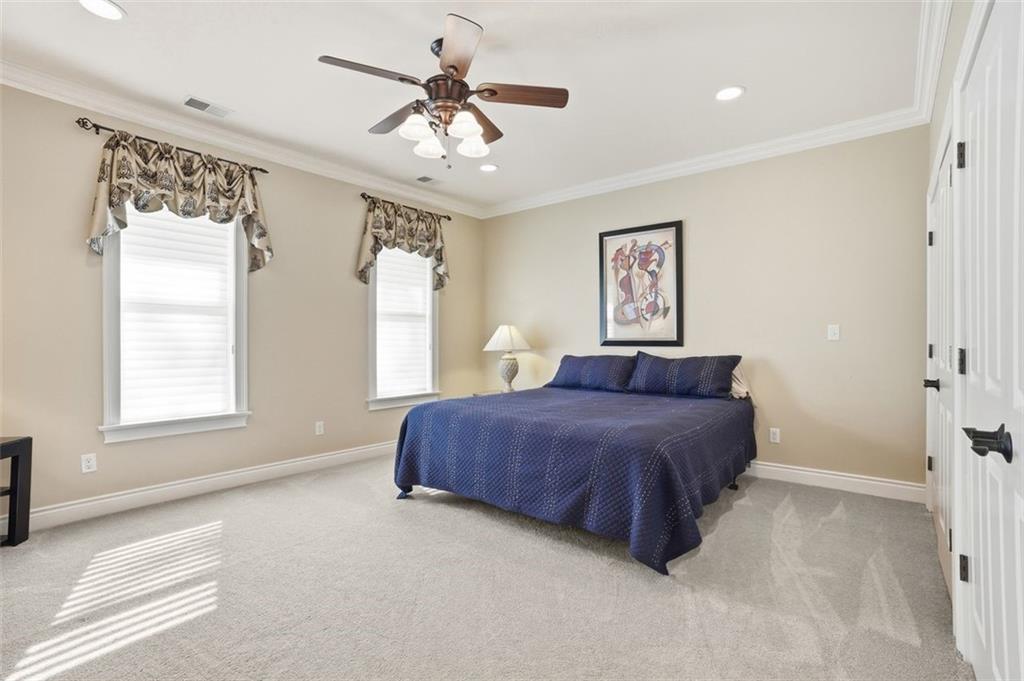 1040 Chanticleer Drive Crescent, PA 15046 - Photo 26 of 50 a spacious bedroom with a large bed and a chandelier