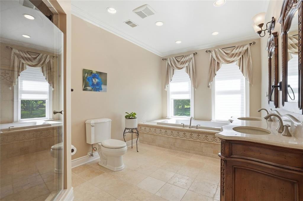 1040 Chanticleer Drive Crescent, PA 15046 - Photo 27 of 50 a spacious bathroom with a bathtub a sink and a large mirror