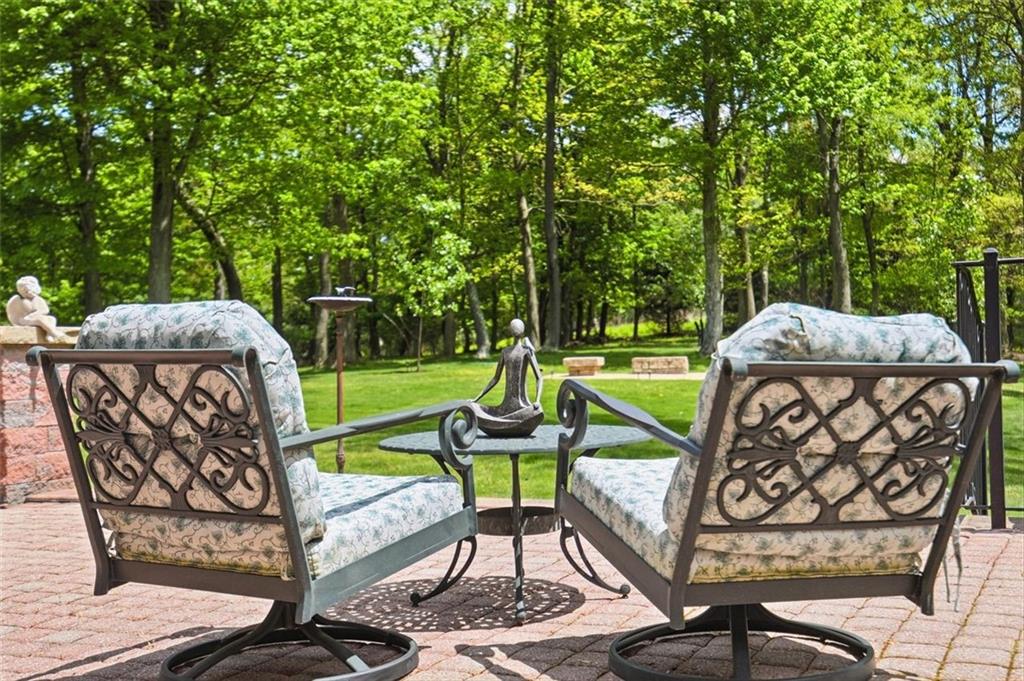 1040 Chanticleer Drive Crescent, PA 15046 - Photo 40 of 50 a view of a chairs and table in backyard of the house