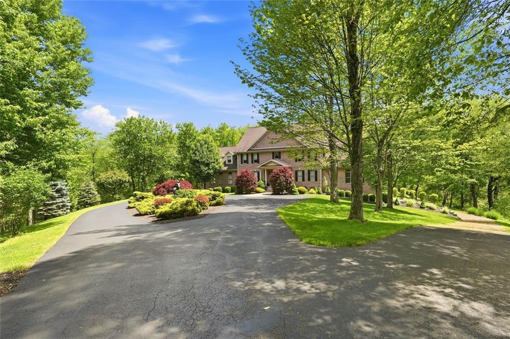 1040 Chanticleer Drive Crescent, PA 15046 - Photo 4 of 50 a view of a yard with yellow house