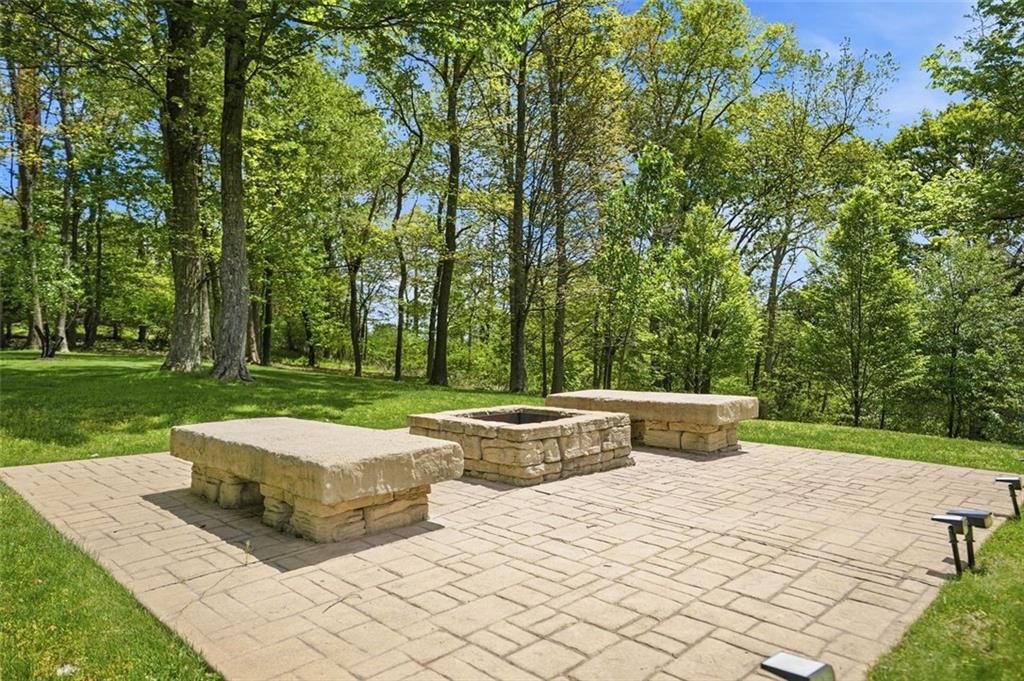 1040 Chanticleer Drive Crescent, PA 15046 - Photo 42 of 50 a view of a patio with table and chairs potted plants and large trees