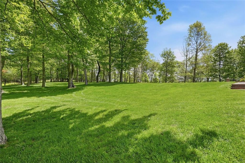 1040 Chanticleer Drive Crescent, PA 15046 - Photo 44 of 50 a view of a grassy field with trees in the background