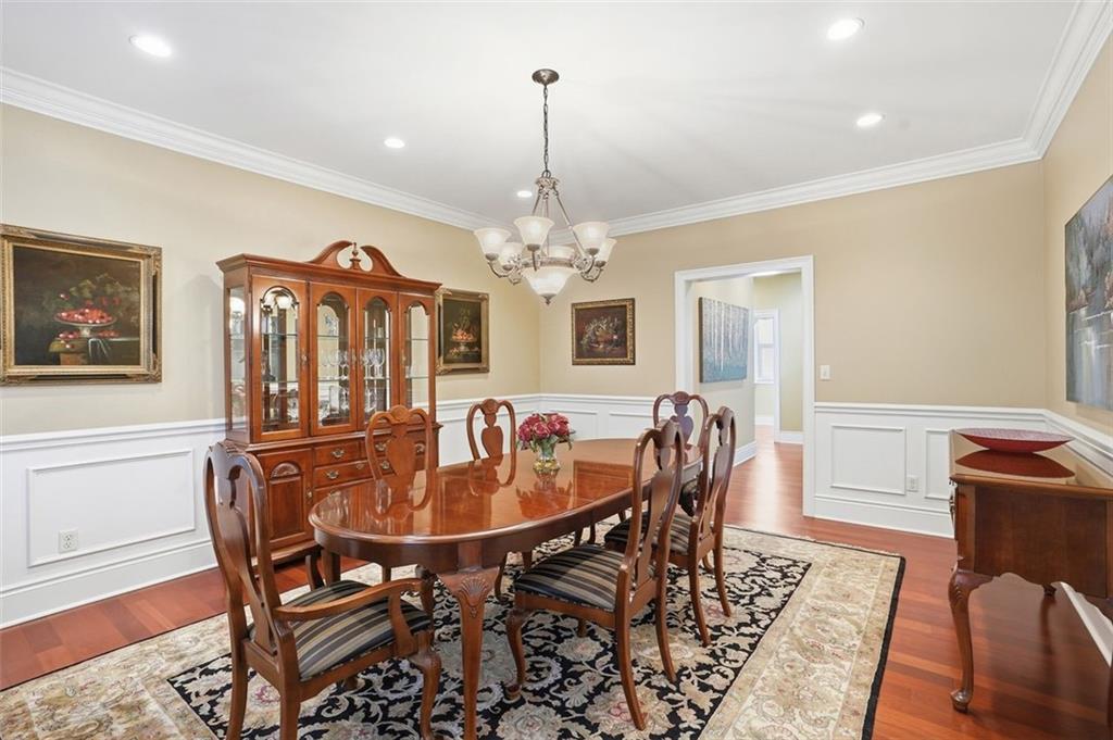 1040 Chanticleer Drive Crescent, PA 15046 - Photo 9 of 50 a dining room with furniture a chandelier and wooden floor