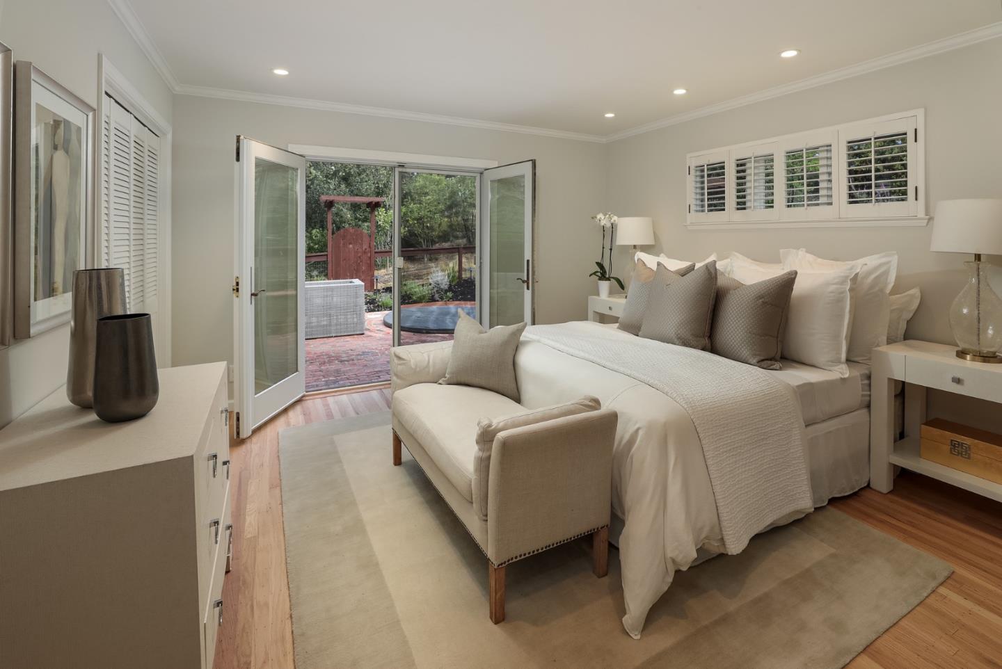 10490 Florence Drive Cupertino, CA 95014 - Photo 13 of 17 a bedroom with bed and glass door