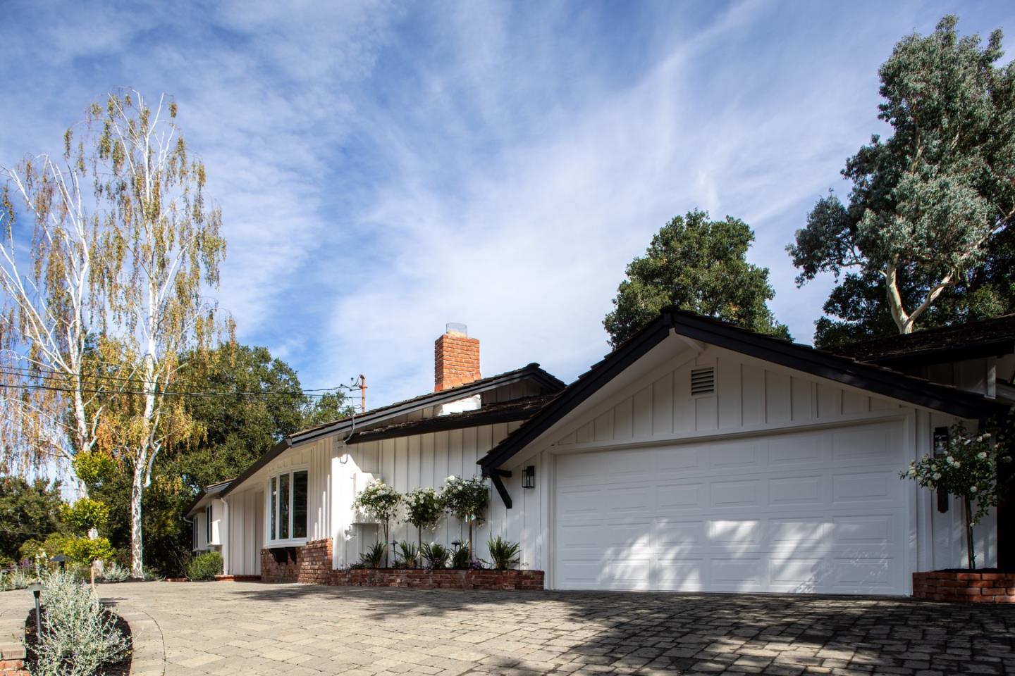 10490 Florence Drive Cupertino, CA 95014 - Photo 2 of 17 a front view of a house with a yard