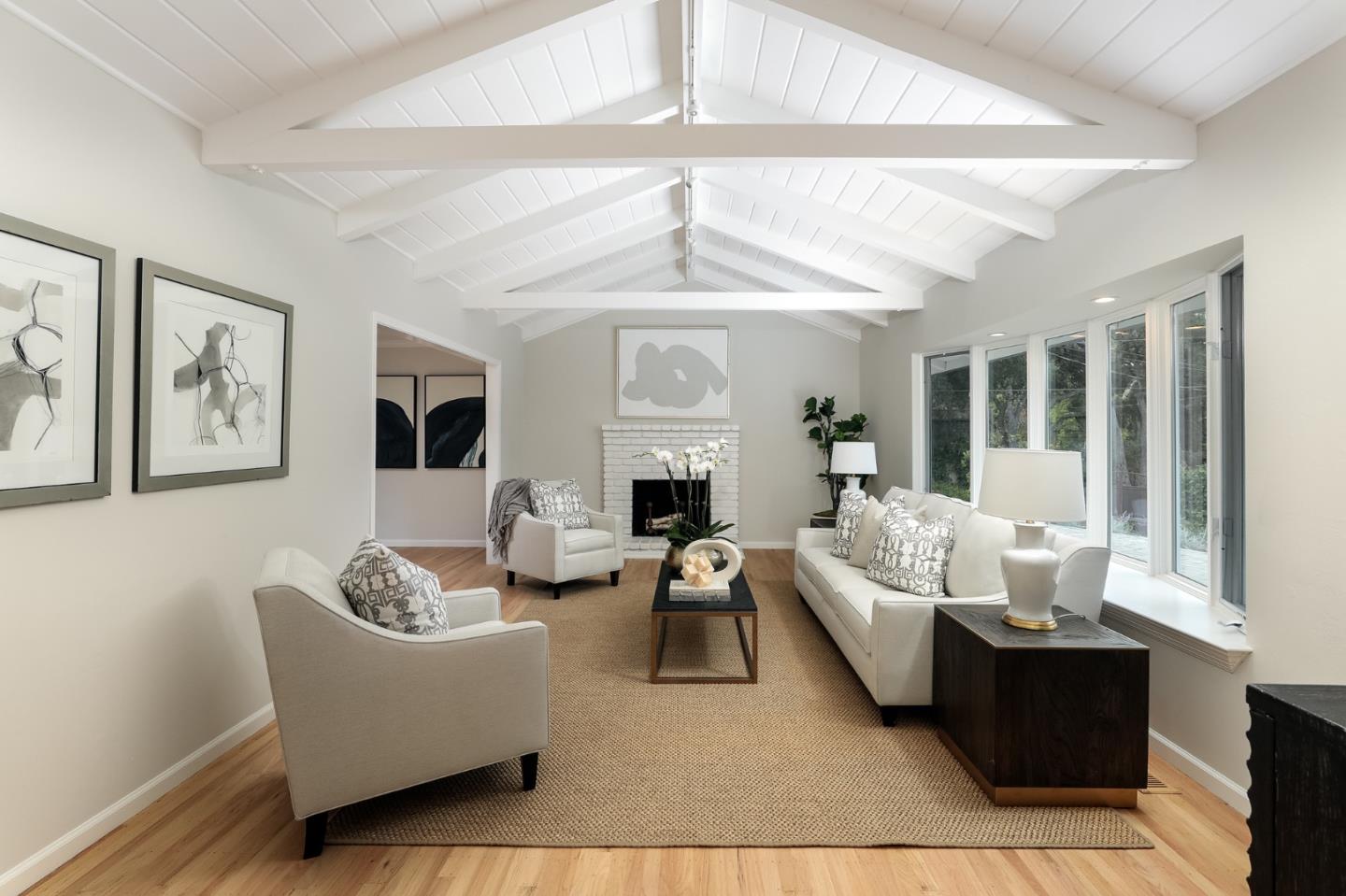 10490 Florence Drive Cupertino, CA 95014 - Photo 3 of 17 a living room with furniture and a fireplace