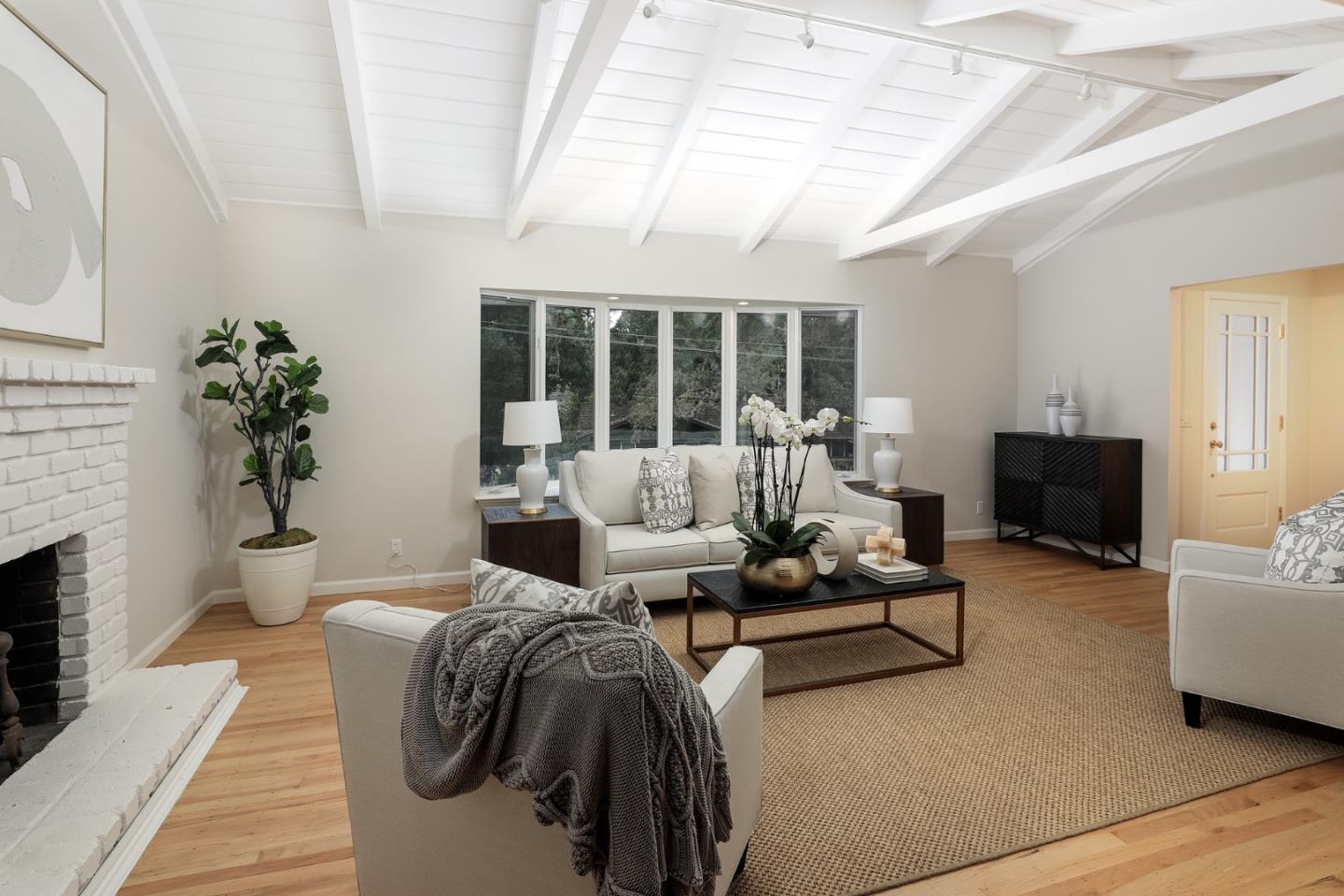 10490 Florence Drive Cupertino, CA 95014 - Photo 4 of 17 a living room with furniture and a fireplace