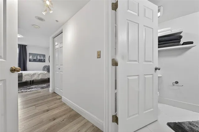 a bedroom with a bed and a view of bathroom