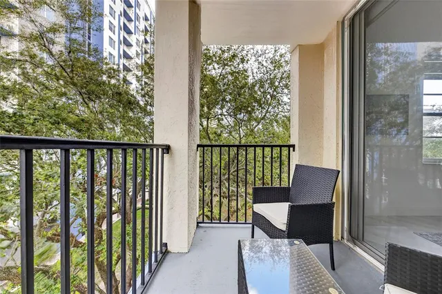 a balcony view with a seating space