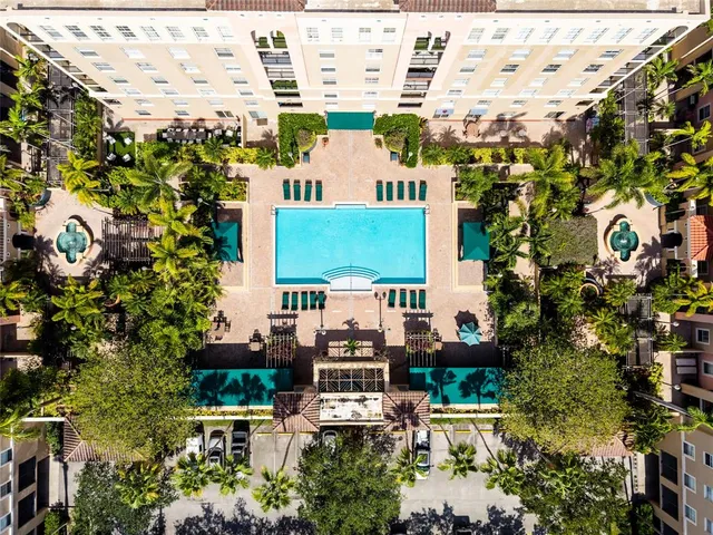 a swimming pool view with a outdoor seating