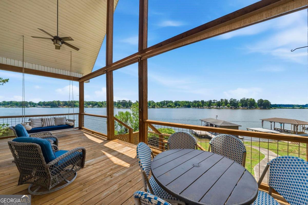 172 Mays Road Milledgeville, GA 31061 - Photo 40 of 54 a view of a roof deck with couches and wooden floor