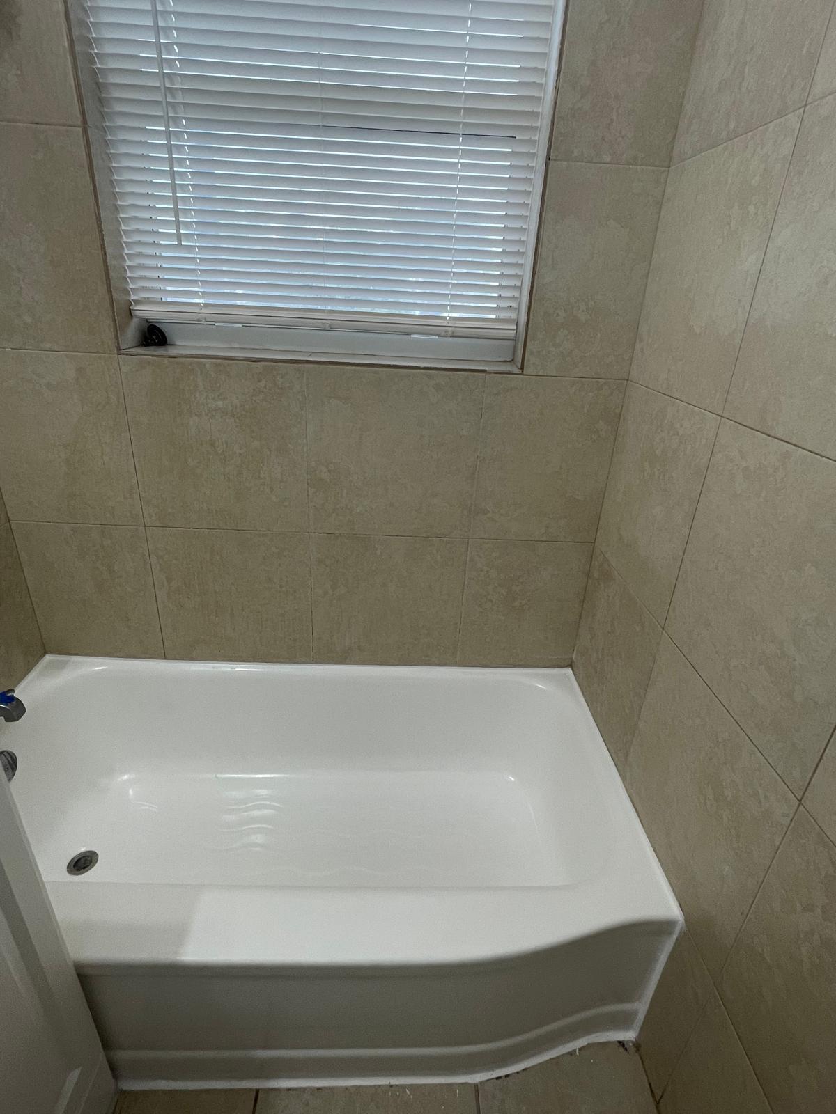 6910 Byron Avenue, Unit 3 Miami Beach, FL 33141 - Photo 12 of 12 a bathroom with a bathtub