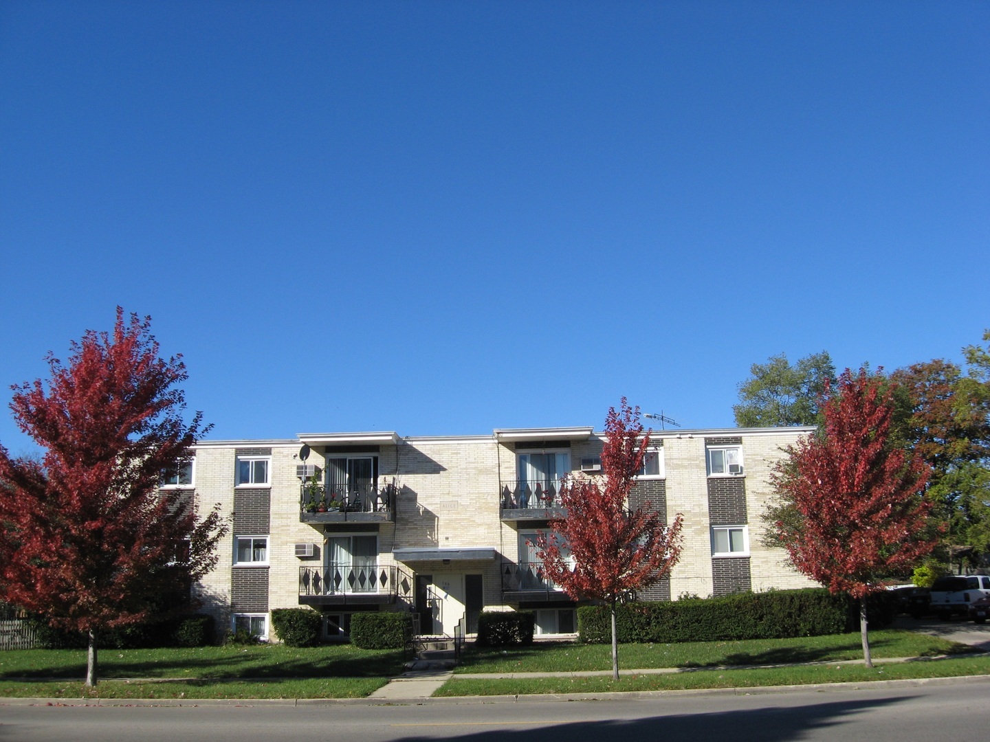a view of a building with a yard
