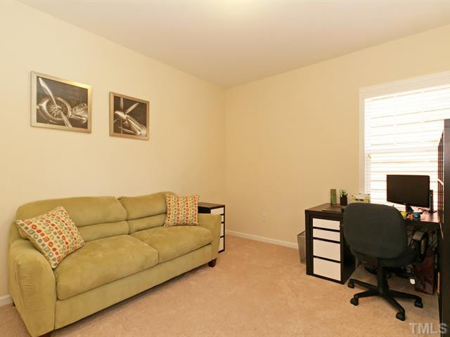 1403 Van Page Boulevard Raleigh, NC 27607 - Photo 20 of 25 The two secondary bedrooms are each a nice size with double door closets. Bedroom