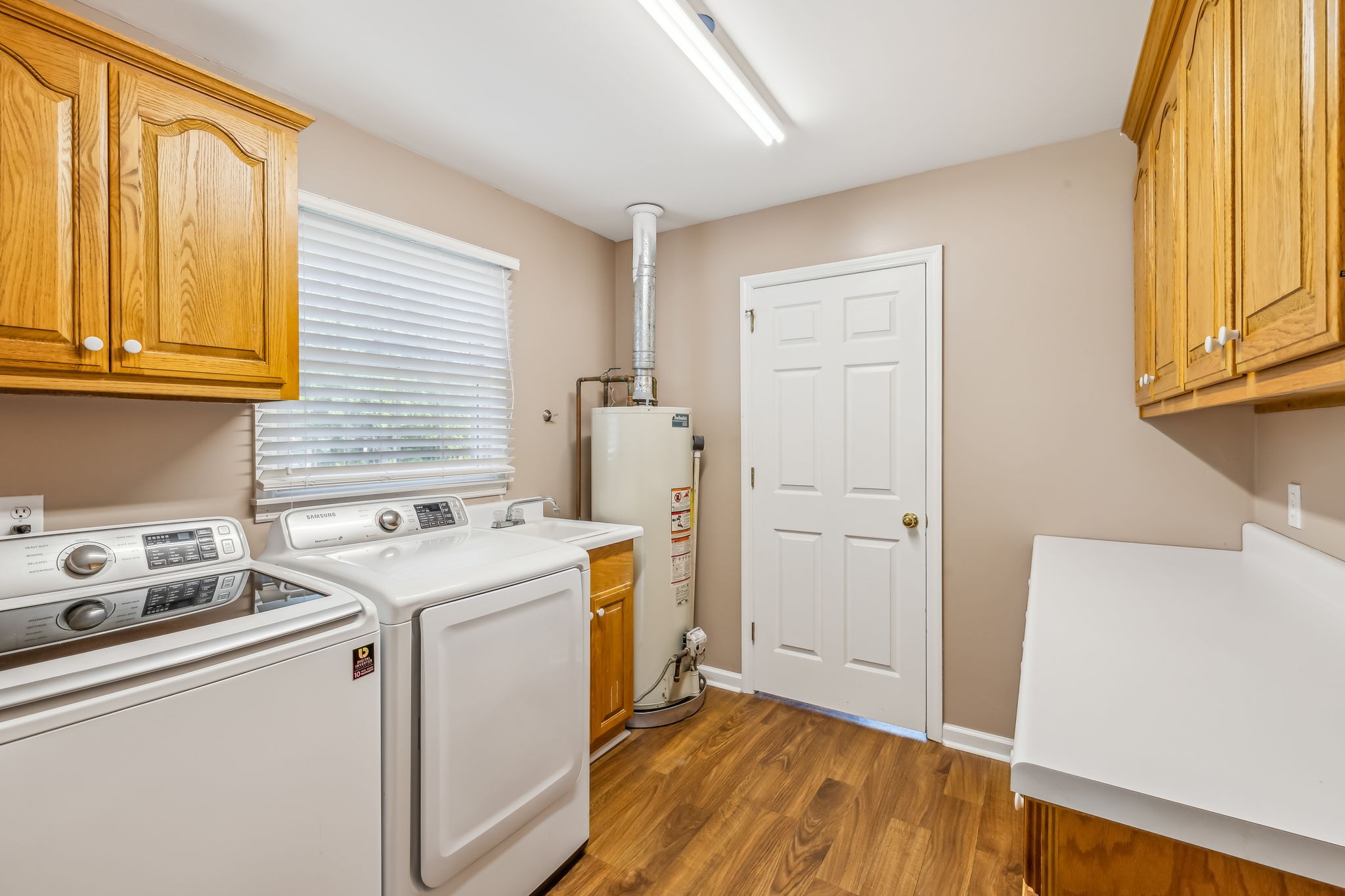 4152 Old Coopertown Road Springfield, TN 37172 - Photo 23 of 70 Separate laundry room with cabinets, sink and folding area