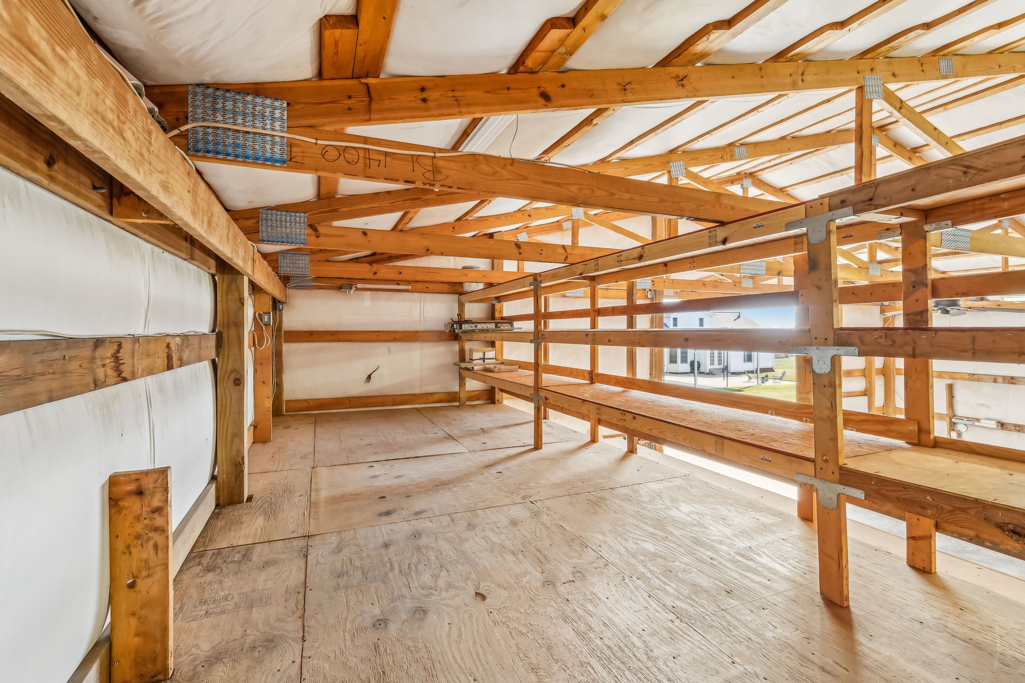 4152 Old Coopertown Road Springfield, TN 37172 - Photo 54 of 70 Upstairs storage loft can be finished off to add another room or use for great storage - solid shelving