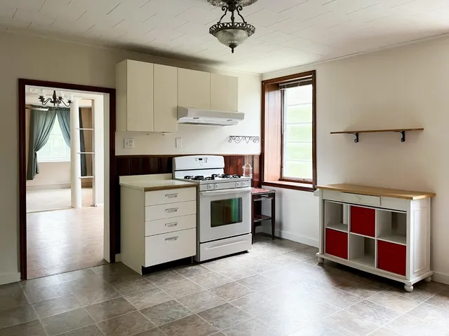 a kitchen with stainless steel appliances a stove and a refrigerator