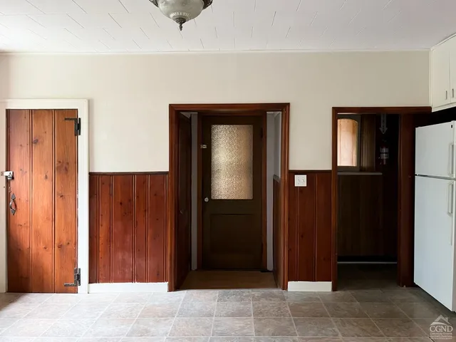 a kitchen with stainless steel appliances a sink and a refrigerator