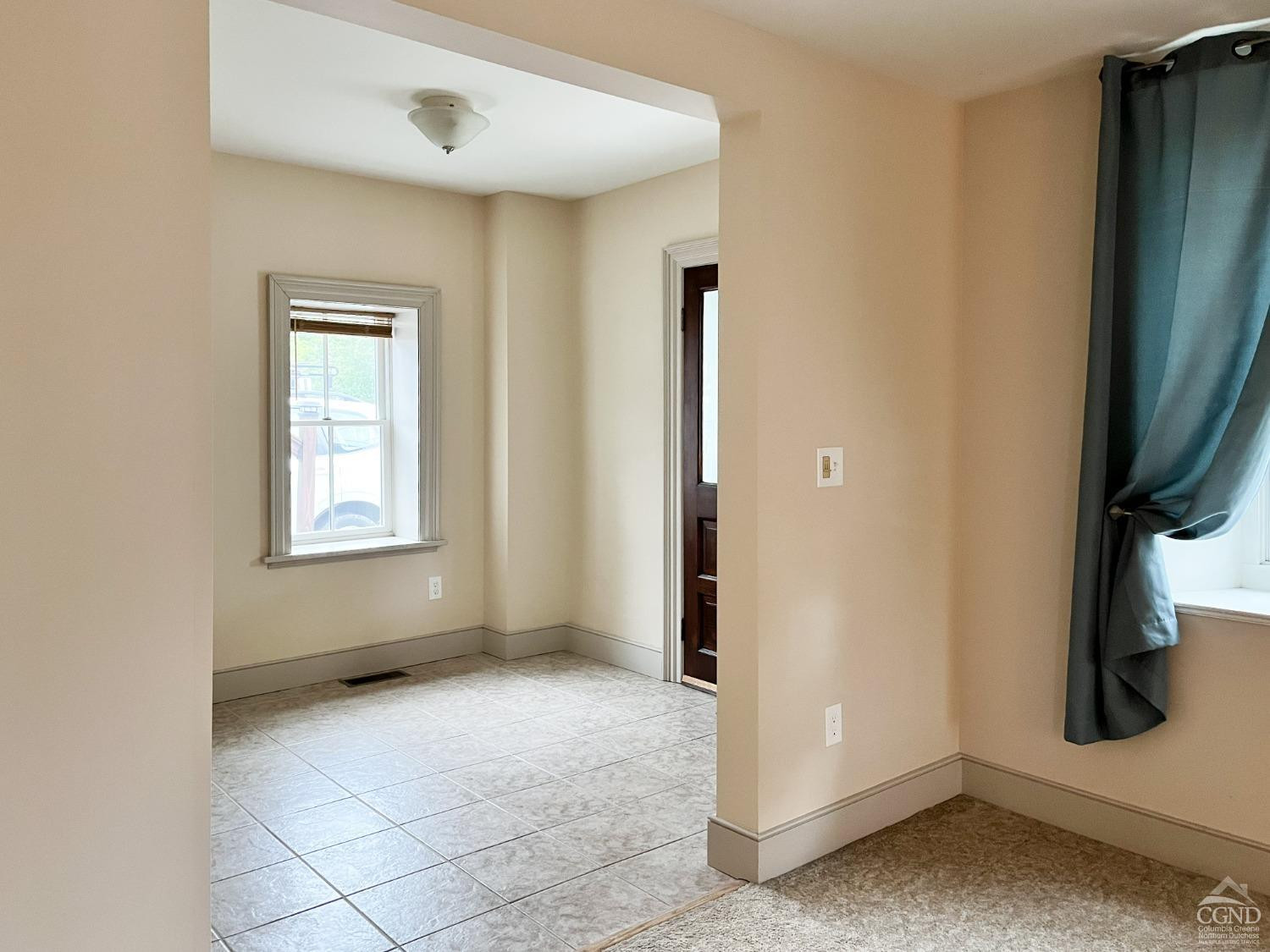 122 2nd Street, Unit 1 Athens, NY 12015 - Photo 2 of 26 an empty room with windows