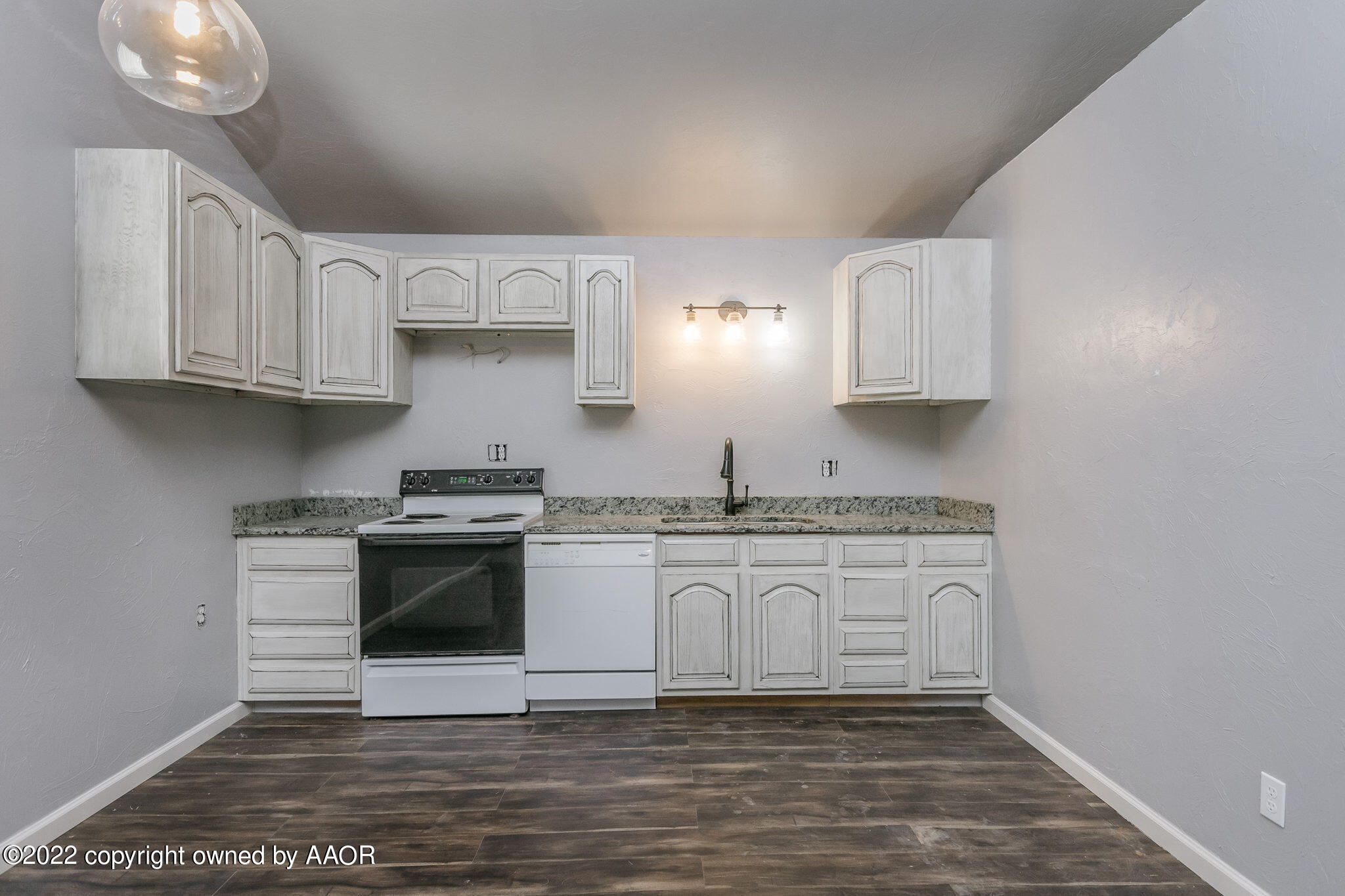 100 Alamo Street Claude, TX 79019 - Photo 19 of 39 a kitchen with stainless steel appliances granite countertop a sink and a stove