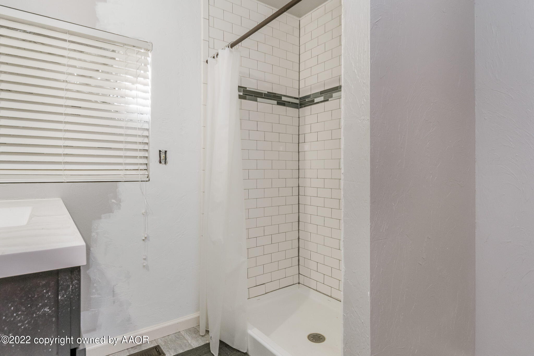 100 Alamo Street Claude, TX 79019 - Photo 23 of 39 a bathroom with a shower and a sink