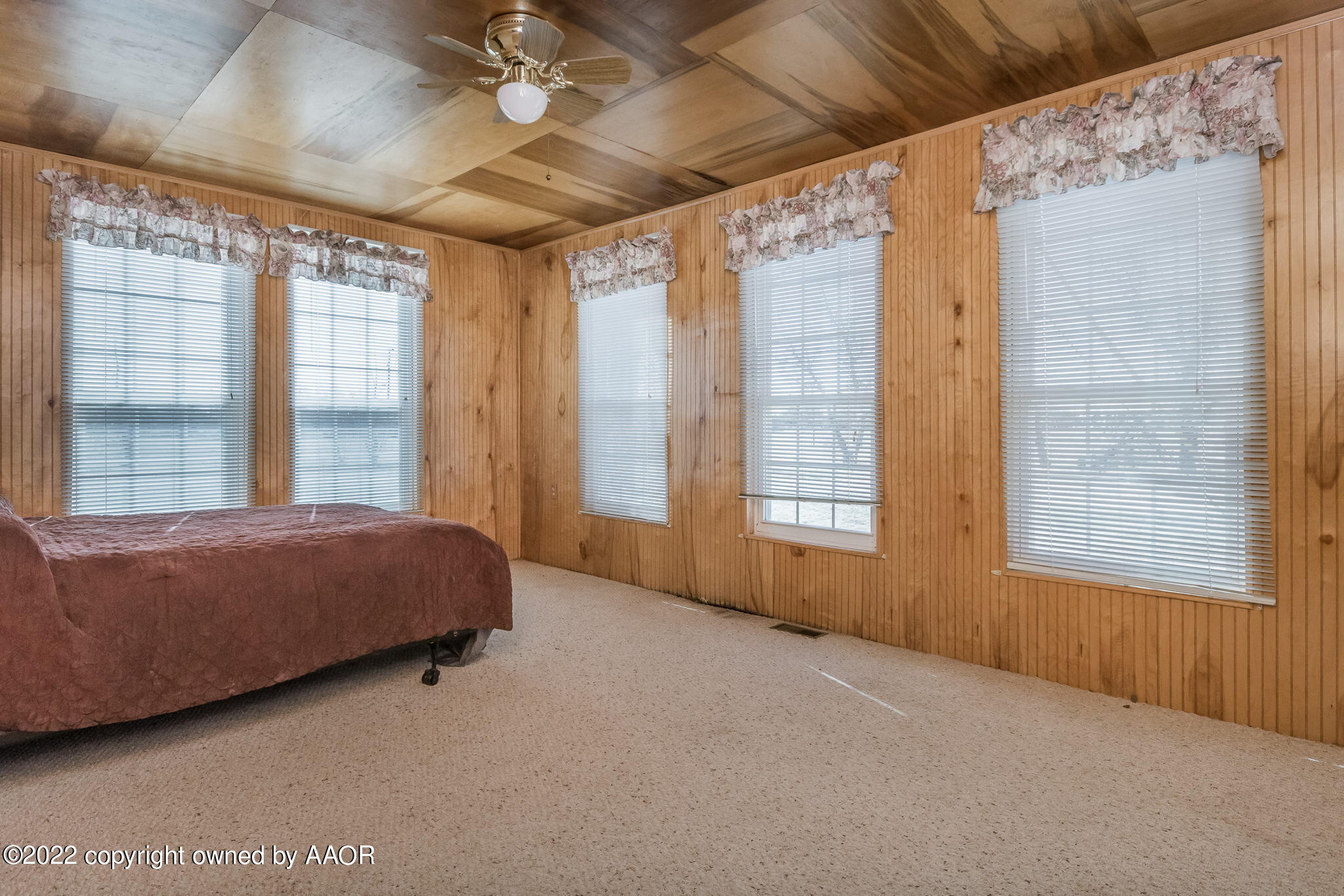 100 Alamo Street Claude, TX 79019 - Photo 24 of 39 a spacious bedroom with a large bed and a large window