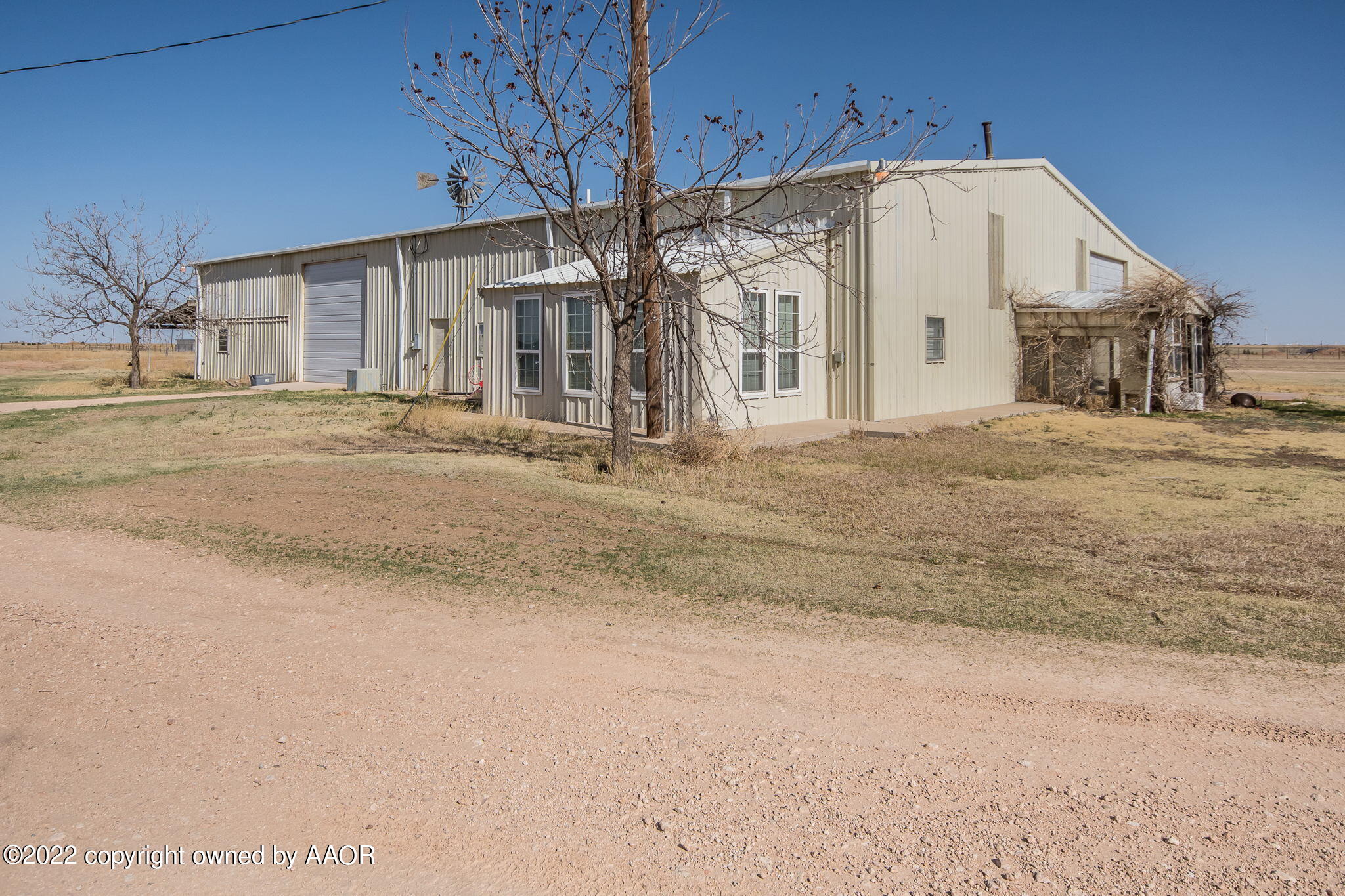 100 Alamo Street Claude, TX 79019 - Photo 4 of 39 a white house with a white door
