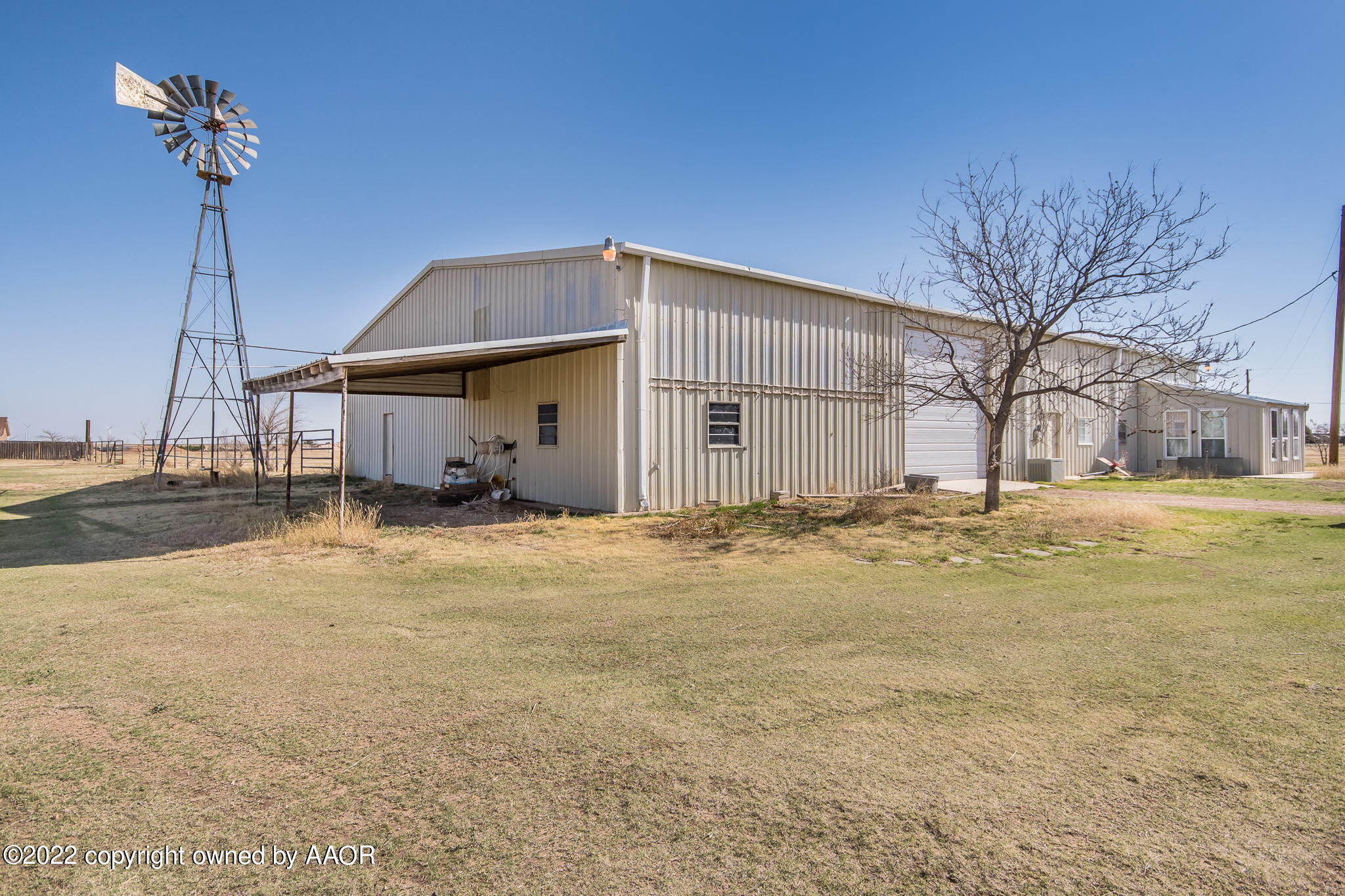 100 Alamo Street Claude, TX 79019 - Photo 5 of 39 a house view with swimming pool in front of it
