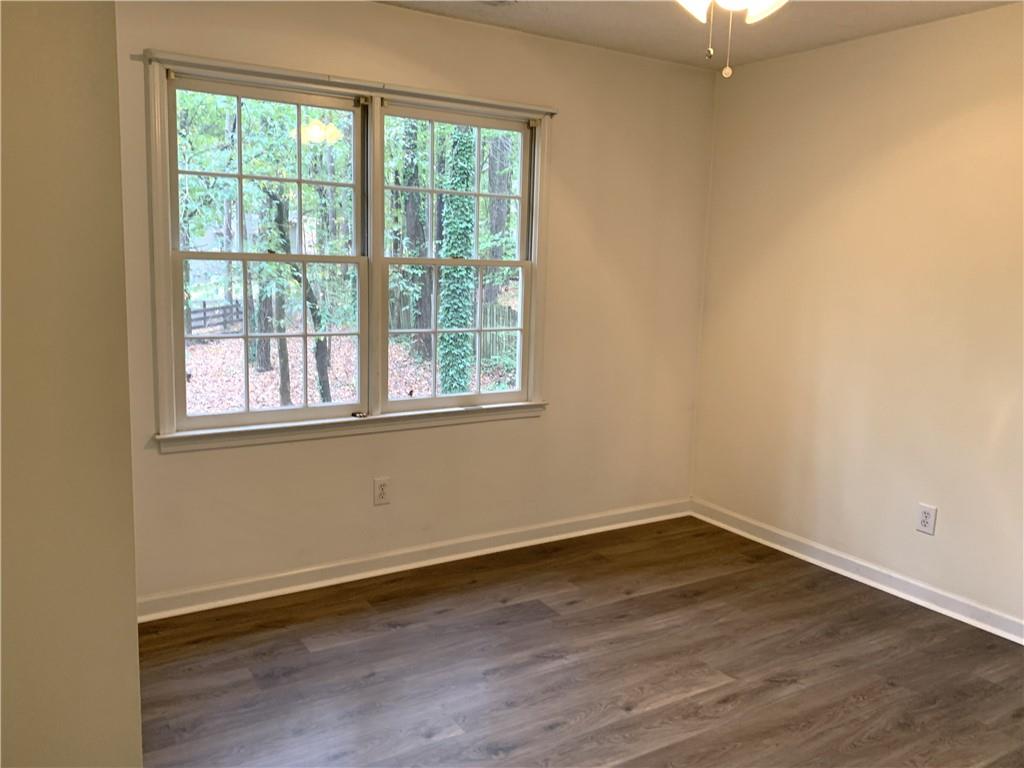 4235 Doubletree Court Cumming, GA 30040 - Photo 17 of 24 a view of a room with wooden floor and windows