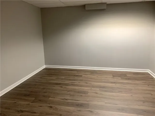 a view of room with wooden floor