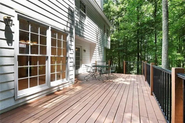 a view of a house with a large window and wooden floor