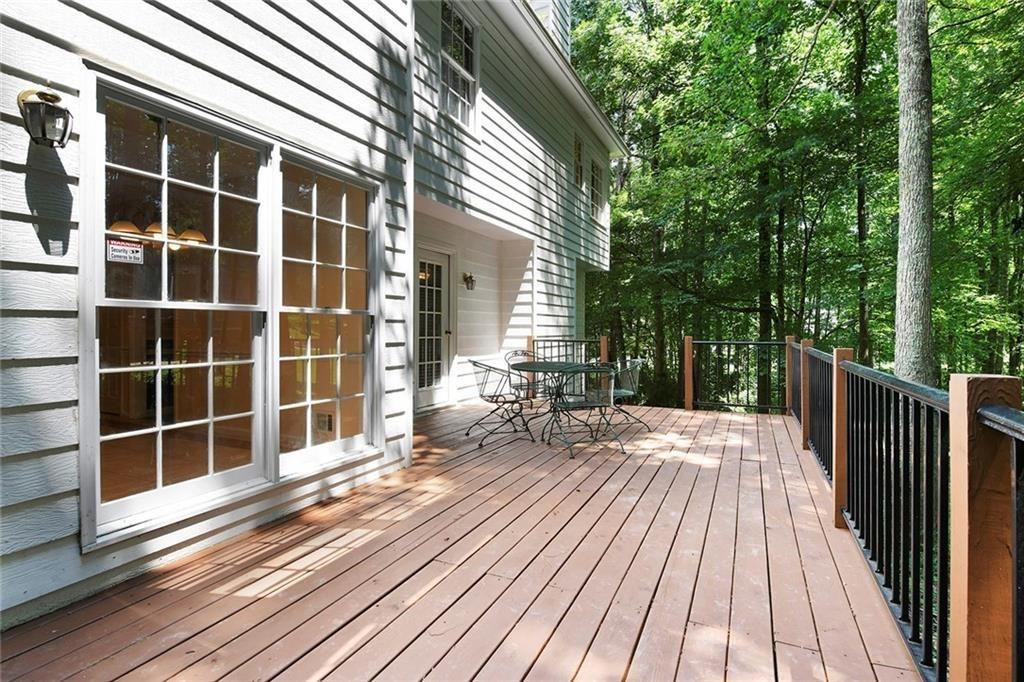 4235 Doubletree Court Cumming, GA 30040 - Photo 22 of 24 a view of a house with a large window and wooden floor